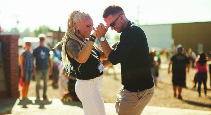 Two dancers salsa dancing outside during Crockstock Music Festival at Medalta.